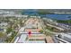 Aerial view of condo community with well-maintained landscaping, parking, and water views at 10038 62Nd N Ter # 1, St Petersburg, FL 33708