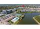 Aerial view of community amenities including pool, tennis courts, and lakefront location at 10038 62Nd N Ter # 1, St Petersburg, FL 33708