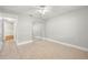 Neutral-toned bedroom with tile floors, ceiling fan, and mirrored closet at 10038 62Nd N Ter # 1, St Petersburg, FL 33708