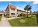 Exterior view of condo buildings with well-maintained landscaping and walkways at 10038 62Nd N Ter # 1, St Petersburg, FL 33708