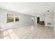 Spacious living room with tile floors and large windows providing ample natural light at 10038 62Nd N Ter # 1, St Petersburg, FL 33708