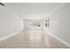 Spacious living room with tile flooring, neutral walls, natural light, and ample room to entertain at 10038 62Nd N Ter # 1, St Petersburg, FL 33708
