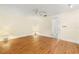 Comfortable main bedroom with wood floors, neutral walls, and an open doorway to the hallway at 10038 62Nd N Ter # 1, St Petersburg, FL 33708