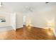 Serene main bedroom with wood floors, neutral walls, and view to the main bathroom at 10038 62Nd N Ter # 1, St Petersburg, FL 33708
