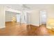 Spacious main bedroom features mirrored closet doors, wood floors, and neutral decor at 10038 62Nd N Ter # 1, St Petersburg, FL 33708