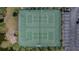 Overhead view of well-maintained tennis courts and adjacent parking at 10038 62Nd N Ter # 1, St Petersburg, FL 33708