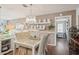 Cozy dining area featuring stylish white furniture, hardwood floors, and decorative accents at 10722 Footprint Ln, Port Richey, FL 34668