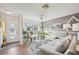 Inviting living room with a large window, neutral tones, and comfortable seating area at 10722 Footprint Ln, Port Richey, FL 34668