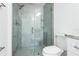 Modern bathroom featuring a walk-in shower with glass door and tiled walls at 114 25Th E St, Palmetto, FL 34221