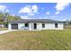 Charming one-story home featuring a well-manicured lawn, single car garage, and modern design elements at 114 25Th E St, Palmetto, FL 34221
