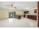 Open kitchen features granite counters, wooden cabinets, and views of backyard at 11845 Meadowdale Dr, Tampa, FL 33625