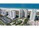 Coastal community featuring high-rise condos, tennis courts, parking, and beautiful green spaces at 1200 Gulf Blvd # 902, Clearwater Beach, FL 33767