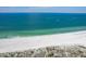 Breathtaking aerial view of a pristine beach with clear turquoise waters and endless white sands at 1200 Gulf Blvd # 902, Clearwater Beach, FL 33767
