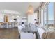 Modern dining area with scenic views and stylish pendant lighting, connected to kitchen at 1200 Gulf Blvd # 902, Clearwater Beach, FL 33767