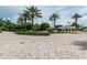 Paver driveway with lush landscaping and a guard house offers an inviting entry to the property at 1200 Gulf Blvd # 902, Clearwater Beach, FL 33767