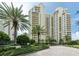 Impressive condo building surrounded by lush landscaping and a grand entrance, near the beach at 1200 Gulf Blvd # 902, Clearwater Beach, FL 33767