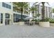 Beautiful condominium exterior with a large patio space and lush landscaping at 1200 Gulf Blvd # 902, Clearwater Beach, FL 33767
