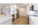 Modern kitchen with stainless appliances, sleek cabinetry and bar seating at 1200 Gulf Blvd # 902, Clearwater Beach, FL 33767