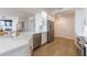 Bright modern kitchen with white cabinets, stainless steel appliances, and a farmhouse sink at 1200 Gulf Blvd # 902, Clearwater Beach, FL 33767