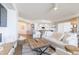 Bright, open living area with modern furnishings and access to the kitchen at 1200 Gulf Blvd # 902, Clearwater Beach, FL 33767