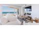 Bright and airy living room with ocean views, comfortable seating, and a modern fireplace at 1200 Gulf Blvd # 902, Clearwater Beach, FL 33767
