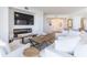 Cozy living room featuring a fireplace, TV, and comfortable white seating at 1200 Gulf Blvd # 902, Clearwater Beach, FL 33767