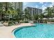 Well-maintained community pool area with scenic views offering a refreshing escape and a vibrant social atmosphere at 1200 Gulf Blvd # 902, Clearwater Beach, FL 33767