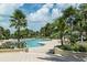 Inviting community pool surrounded by lush tropical landscaping offering a relaxing resort-style experience at 1200 Gulf Blvd # 902, Clearwater Beach, FL 33767