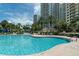 Sparkling community pool with clear blue water and inviting lounge areas offering a perfect spot for relaxation and recreation at 1200 Gulf Blvd # 902, Clearwater Beach, FL 33767