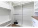 Spacious walk-in closet featuring custom shelving and ample storage options at 1200 Gulf Blvd # 902, Clearwater Beach, FL 33767
