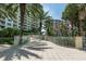 Beautiful walkway with manicured landscaping leading to waterfront access offering a serene path to the beach at 1200 Gulf Blvd # 902, Clearwater Beach, FL 33767