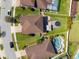 An aerial view of a backyard with a trampoline, gazebo, manicured landscaping, and a swimming pool at 12225 Lake Blvd, New Port Richey, FL 34655