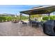 Backyard with a brick patio, gazebo, and an outdoor dining set at 12225 Lake Blvd, New Port Richey, FL 34655