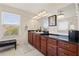 Bathroom boasts double vanity, granite countertop, and bright natural light, creating a serene and functional space at 12225 Lake Blvd, New Port Richey, FL 34655
