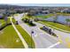 A gated community entrance with lush landscaping and a decorative community sign at 12225 Lake Blvd, New Port Richey, FL 34655