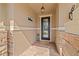 Inviting front porch with brick pavers, decorative stone accents, and elegant front door at 12225 Lake Blvd, New Port Richey, FL 34655