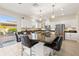 This spacious kitchen boasts an island with bar seating, stainless steel appliances, and bright white cabinetry at 12225 Lake Blvd, New Port Richey, FL 34655