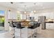 Bright kitchen with stainless steel appliances, kitchen island, and bar stool seating at 12225 Lake Blvd, New Port Richey, FL 34655