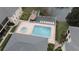 Condo community pool and spa overlook lake with tiki hut at 13140 Village Chase Cir # 13140, Tampa, FL 33618