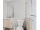 Modern bathroom featuring a sleek vanity, toilet, and glass-enclosed shower at 13140 Village Chase Cir # 13140, Tampa, FL 33618