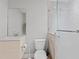 Modern bathroom with sleek vanity, toilet, and glass-enclosed shower at 13140 Village Chase Cir # 13140, Tampa, FL 33618