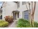 Charming home featuring a covered front entrance surrounded by lush landscaping at 13140 Village Chase Cir # 13140, Tampa, FL 33618