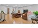 Inviting living area featuring hardwood floors, comfortable seating, and natural light at 13140 Village Chase Cir # 13140, Tampa, FL 33618