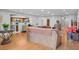 Open floor plan showing a living room connecting to the kitchen area at 13140 Village Chase Cir # 13140, Tampa, FL 33618