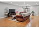 Spacious living room with warm wood floors and comfortable seating arrangement at 13140 Village Chase Cir # 13140, Tampa, FL 33618