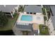 Aerial view of a community pool with a hot tub and lounging area at 13140 Village Chase Cir # 13140, Tampa, FL 33618