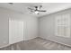 Comfortable bedroom with gray carpet, a window with light-filtering shutters, and a ceiling fan at 14841 Tudor Chase Dr, Tampa, FL 33626