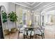 Elegant dining room with modern chandelier, tray ceiling, and beautiful hardwood floors at 14841 Tudor Chase Dr, Tampa, FL 33626