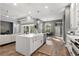 Open concept kitchen features a center island, stainless appliances, eat-in area and views to the Gathering room at 14841 Tudor Chase Dr, Tampa, FL 33626