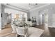 Spacious living room with hardwood floors, contemporary décor, and a seamless transition to the kitchen at 14841 Tudor Chase Dr, Tampa, FL 33626